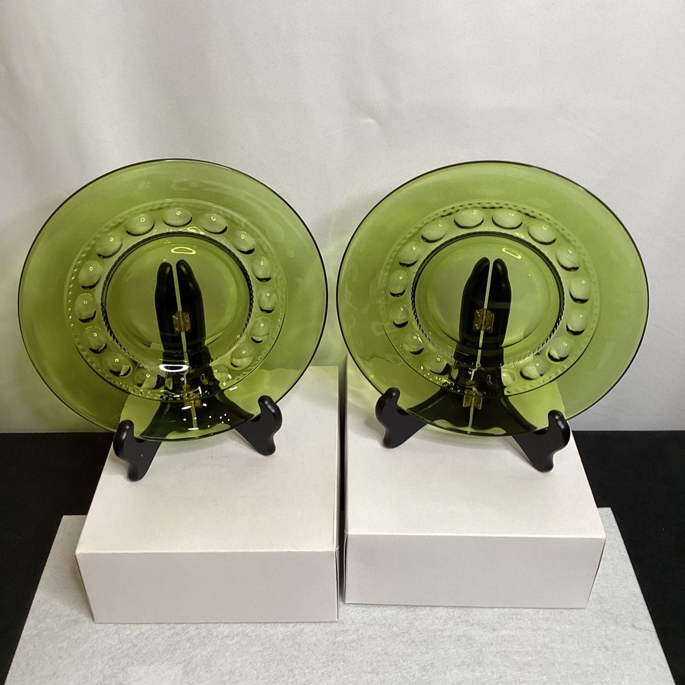 Two avocado green thumb print luncheon plates